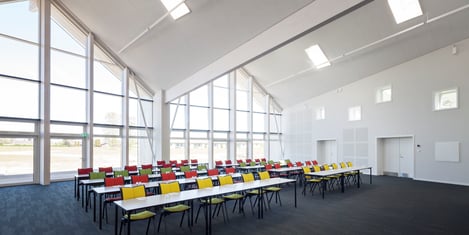 green solution house conference space with skylights