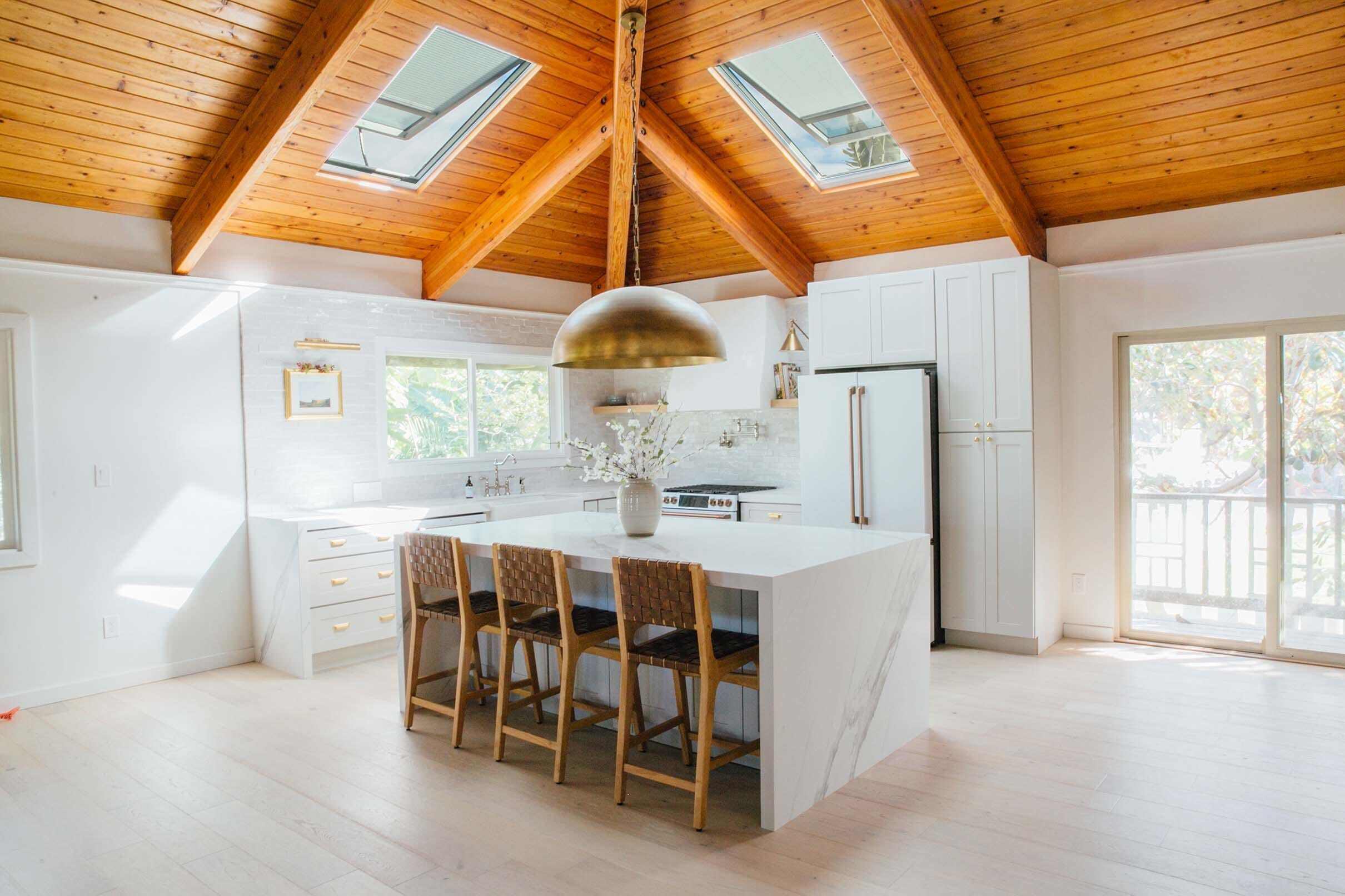 kitchen-wood-ceiling-skylights-white-island