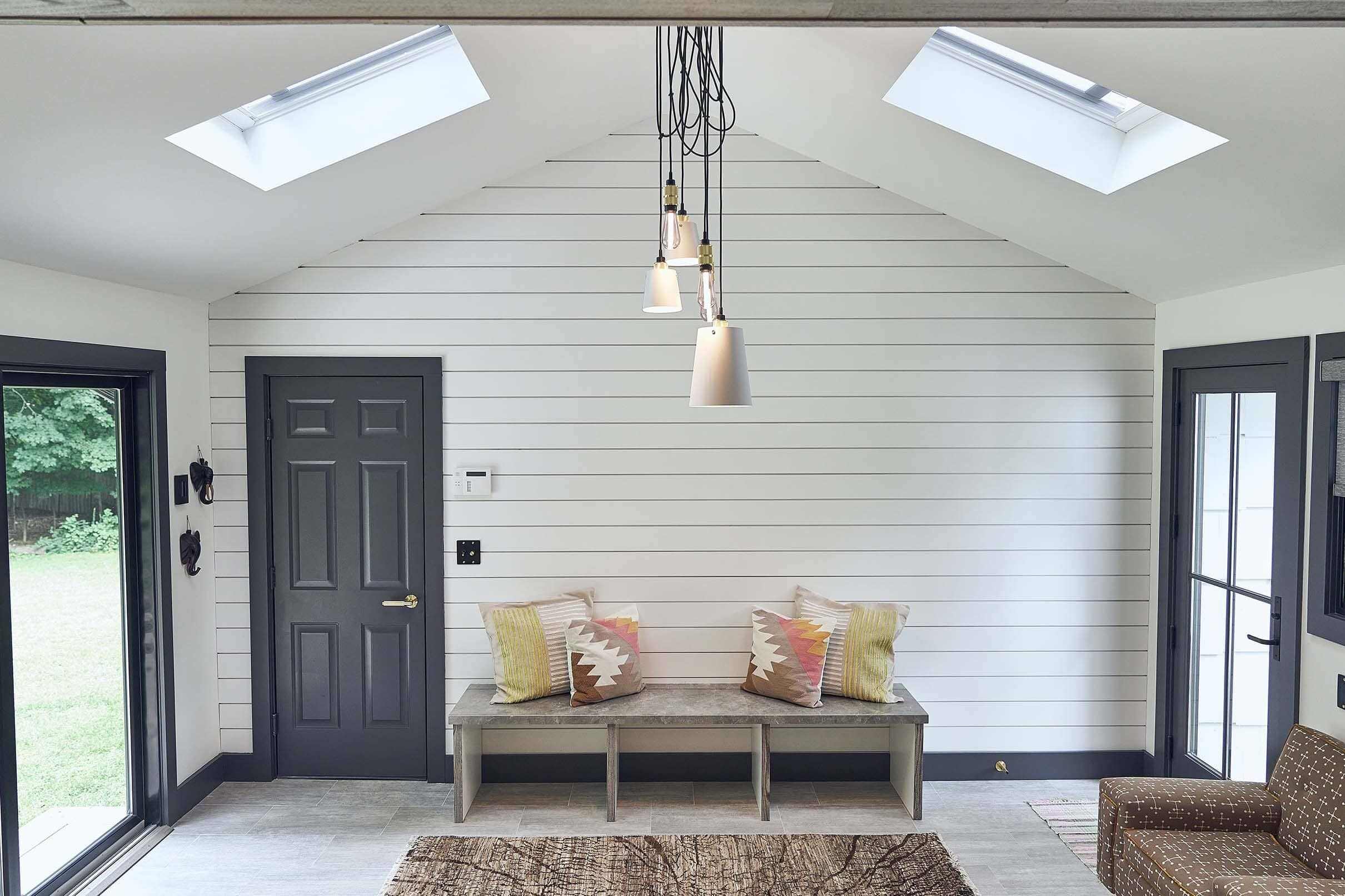 mud-room-white-gray-skylights-bench