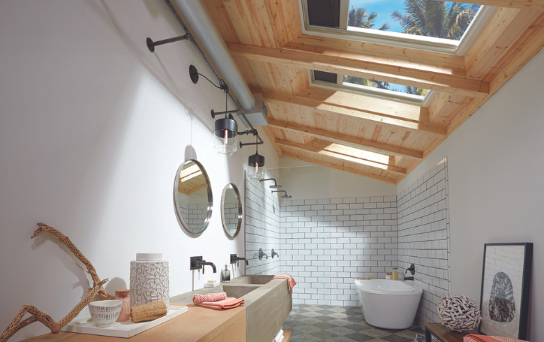 Modern bathroom with three venting skylights with shades.