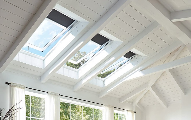 Solar-powered venting skylights with dark blue blinds